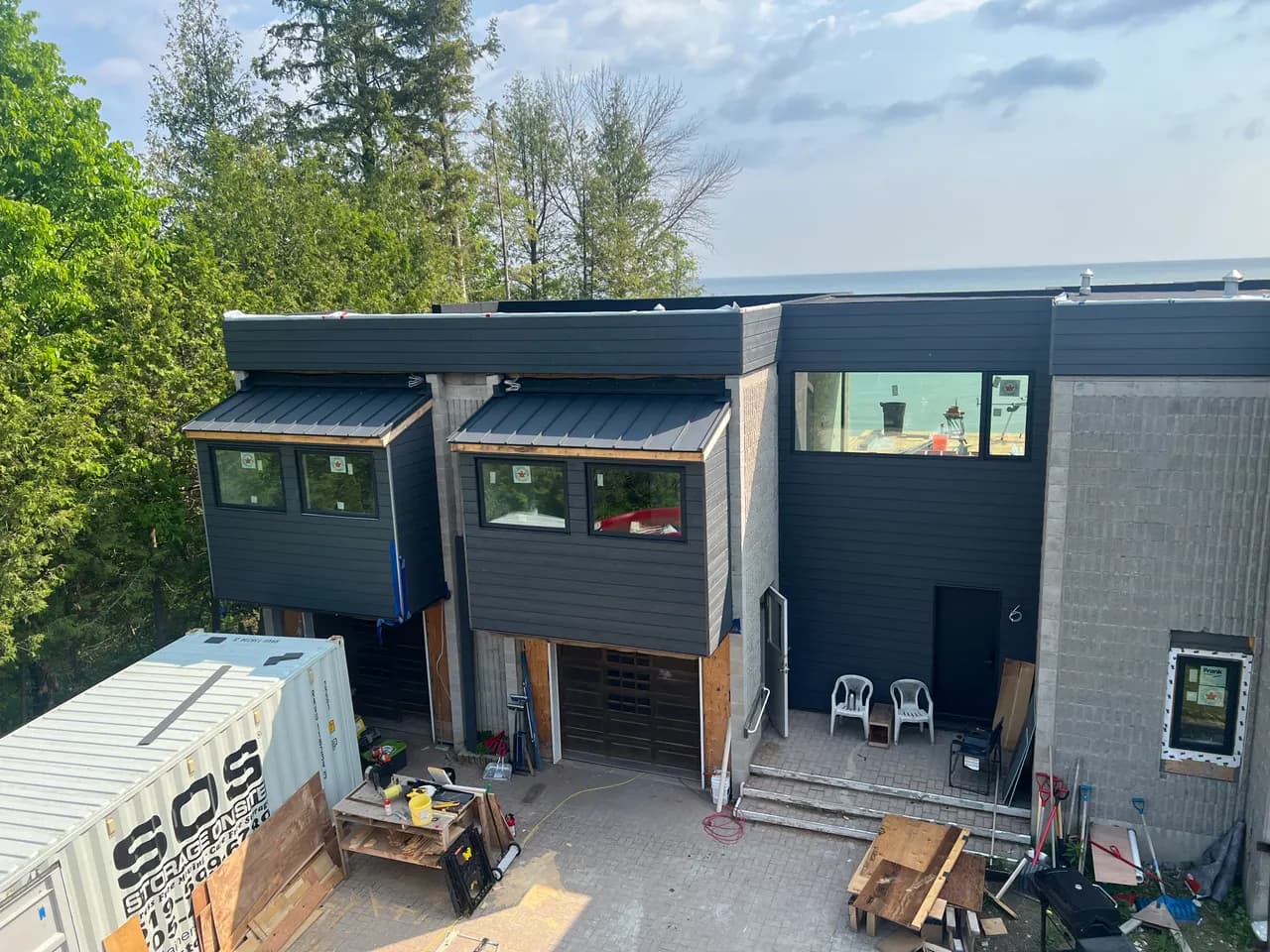 Black modern custom home exterior with mixed cladding