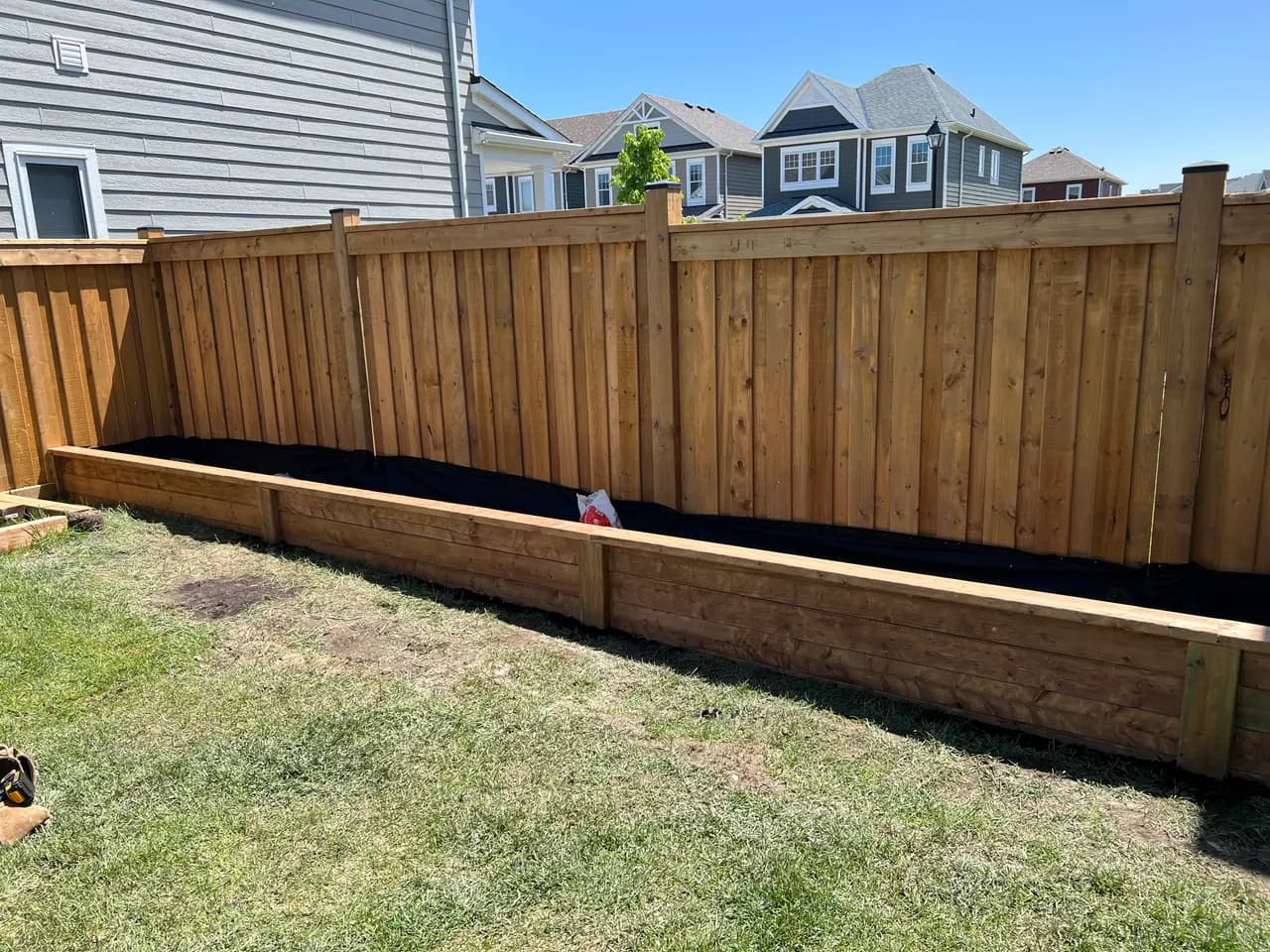Cedar privacy fence with garden bed