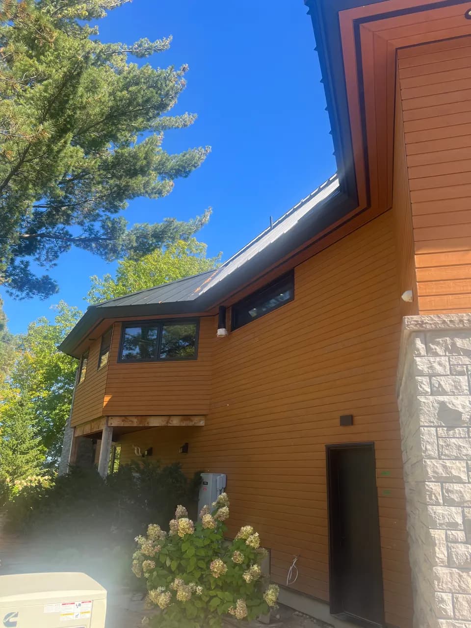 Full view of a cedar-clad custom home