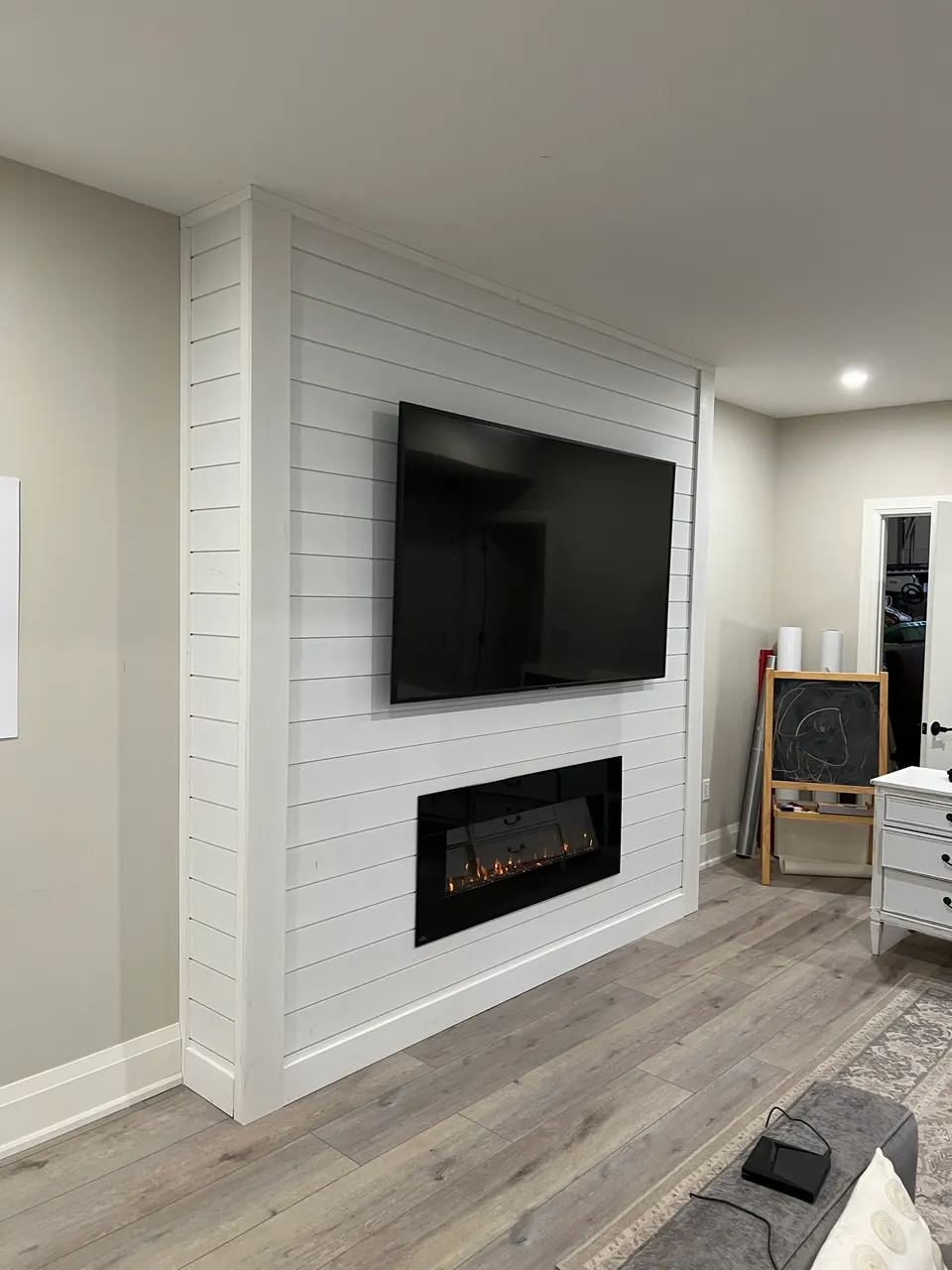 Custom feature wall with linear fireplace and shiplap finish