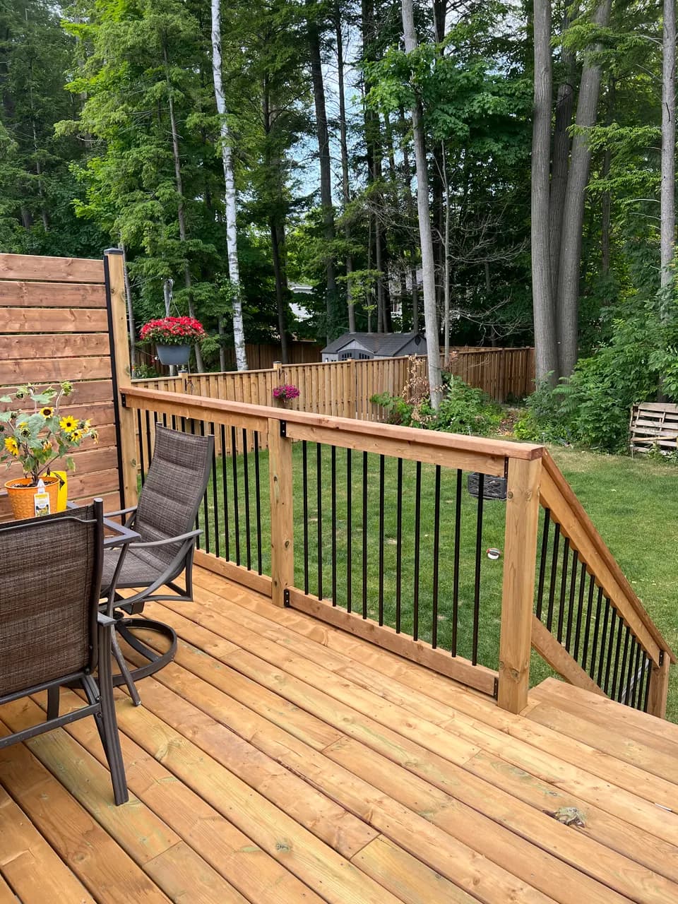 Finished cedar deck with railings and outdoor furniture